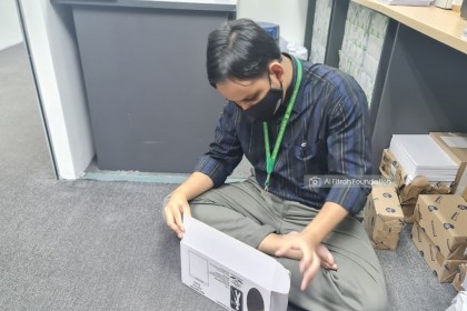 7. Preparing boxes for children's storybooks to be distributed to students at a school